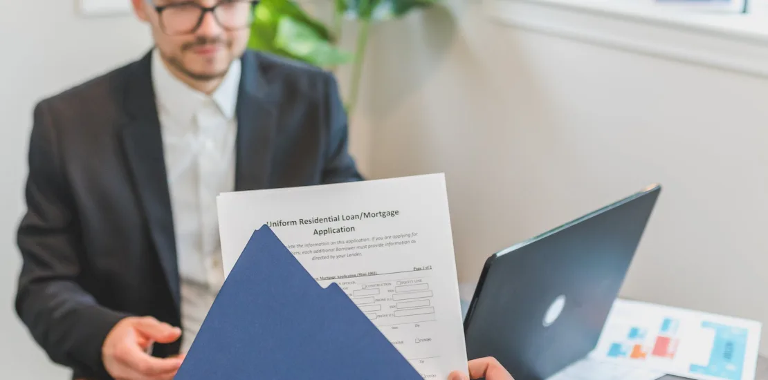 a person holding loan documents